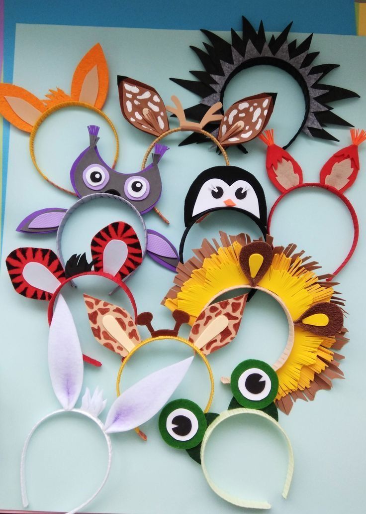 several paper animal masks are arranged on top of each other