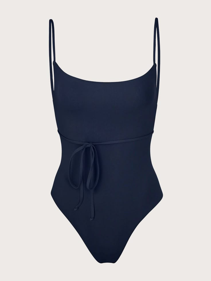 A perennial favorite, the K.M. Tie One-Piece is as chic as it is feminine. Our signature square neckline gives a nod to '90s minimalism while slender straps wrap elegantly around the waist. Finished with a high-cut leg and our classic cheeky bottom, this figure-flattering style will make you feel polished on any coast. We recommend sizing up. Made in LA. Runs small; we recommend sizing up. Size + Fit Please reference Anemos Founder's Tip: If you have a long torso, we recommend sizing up. Materia Old Money One Piece Swimsuit, Swimsuit Full Coverage, Elegant Swimsuit Classy, One Piece Swimsuit Aesthetic, Classy Swimsuit, Classy Swimwear, Elegant Swimsuit, Black One Piece Bathing Suit, 90s Minimalism