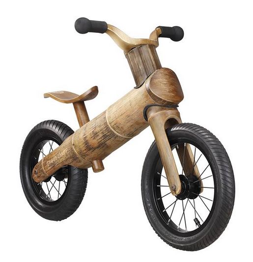 a wooden toy bike with black tires and no pedals on the front wheel is shown against a white background