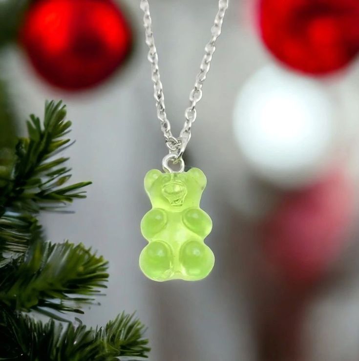 Discover whimsical charm with our Gummy Bear Necklace, a must-have for casual wear enthusiasts! This super cute costume jewelry piece features an adorable gummy bear pendant on a 16-inch chain, with custom lengths available upon request. Perfect for those searching for unique accessories, this Gummy Bear Necklace adds a playful touch to your everyday look. Express your fun and trendy style with this delightful piece. 🐻✨ #GummyBearNecklace Casual Green Necklace For Gift, Fun Green Necklaces For Gift, Fun Green Necklace For Gift, Trendy Green Charm Necklace For Gift, Fun Green Necklaces For Gifts, Playful Green Necklace For Gift, Playful Green Necklace As Gift, Trendy Green Charm Necklace Perfect For Gifts, Playful Green Necklaces For Gift