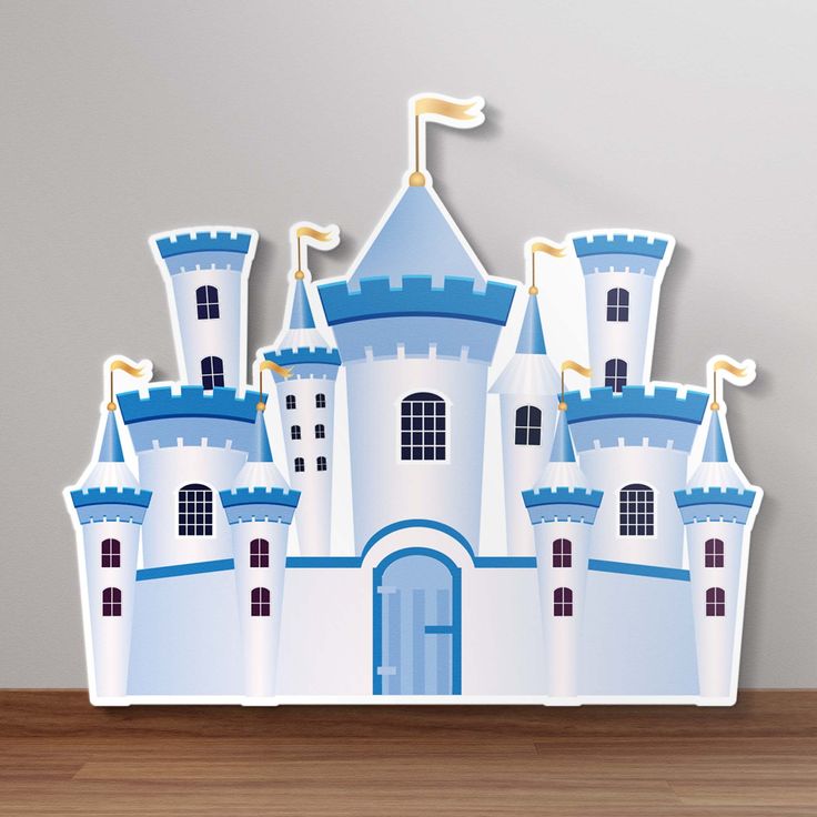 a paper cut out of a castle with blue turrets on it's roof and windows