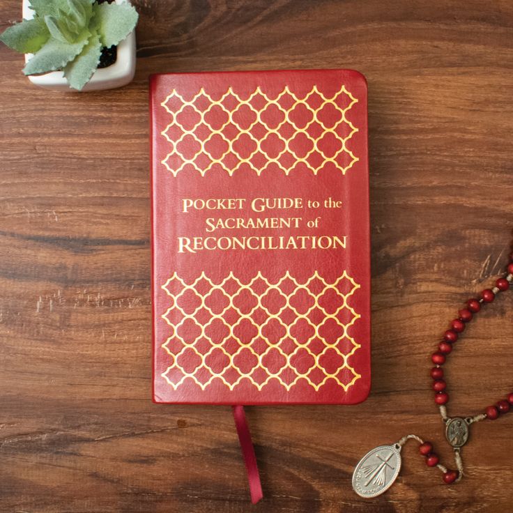 a pocket guide to the sacrament of reconciliation on a wooden table