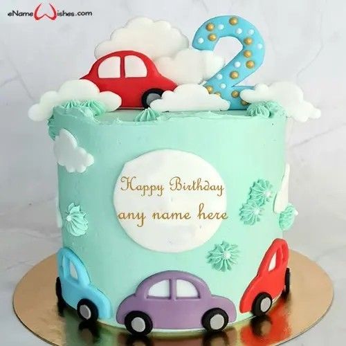 a blue birthday cake with cars and clouds on it's top is the number two