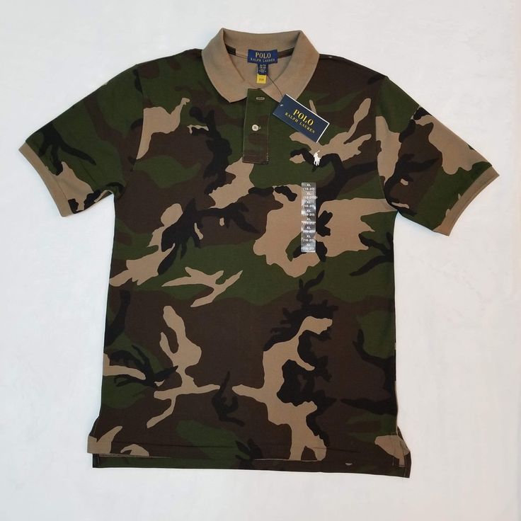 Brand New With Tags Attached Big Kids Size 18-20. * Measurements Are Attached In The Pictures This Should Easily Fit A Small Man Or Small/Medium Woman. See Attached Measurements To Ensure Proper Sizing. Please See All Attached Pictures For Any Additional Details. Green Military Style Short Sleeve Top, Casual Camouflage Cotton Shirt, Casual Cotton Camouflage Shirt, Green Military Style Tops With Graphic Print, Military Style Camouflage Cotton Shirt, Casual Camouflage Short Sleeve Shirt, Green Cotton Polo Shirt With Graphic Print, Casual Khaki Cotton Polo Shirt, Casual Cotton Khaki Polo Shirt