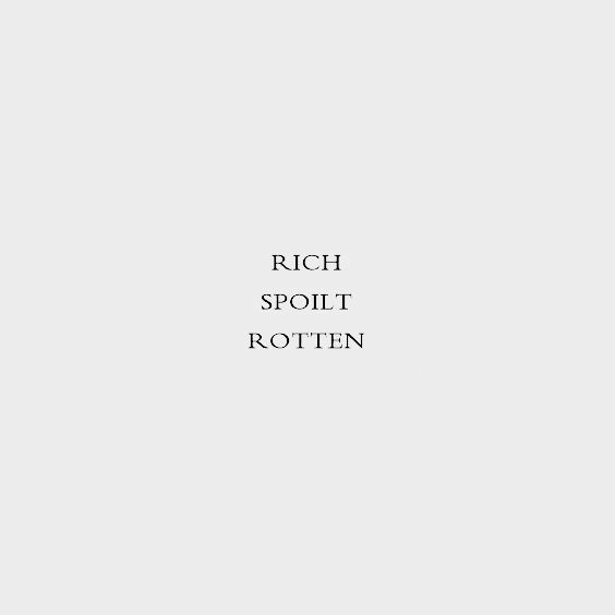 the words rich spolit rotten written in black on a gray background