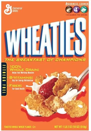 wheaties cereal with yogurt and strawberries on the side, in front of an orange background