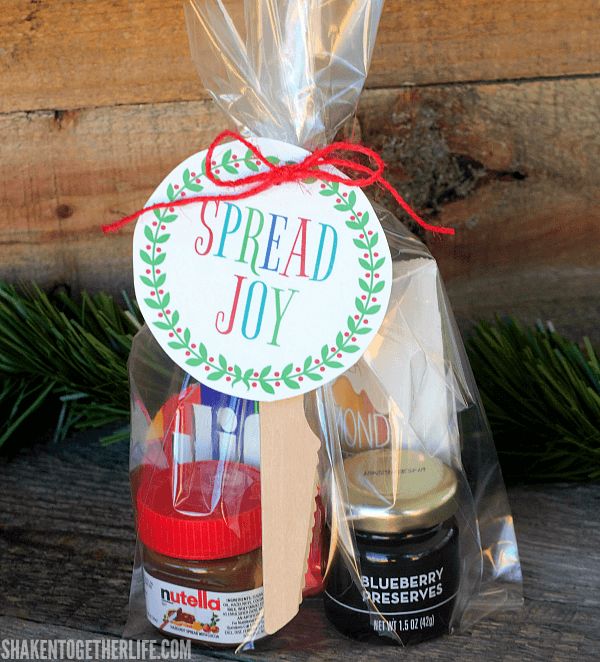 a bag filled with food sitting on top of a wooden table next to christmas decorations