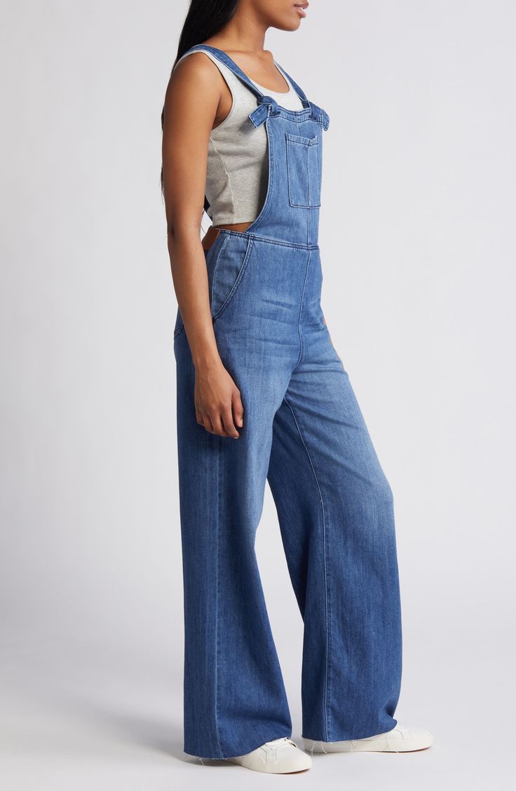 Raw hems and light fading give lived-in appeal to these laid-back overalls cut with a relaxed, straight-leg fit. 29" inseam Square neck Adjustable buckle straps 73% cotton, 27% rayon Machine wash, tumble dry Imported Medium Wash Relaxed Fit Bib Front Jeans, Medium Wash Relaxed Fit Denim Jumpsuit With Bib Front, Relaxed Fit Denim Jeans With Bib Front, Relaxed Fit Bib Front Denim Jeans, Medium Wash Full-length Denim Jumpsuit For Spring, Medium Wash Full Length Denim Jumpsuit For Spring, Full Length Medium Wash Denim Jumpsuit For Spring, High Rise Medium Wash Relaxed Fit Overalls, Relaxed Fit High Rise Light Wash Overalls