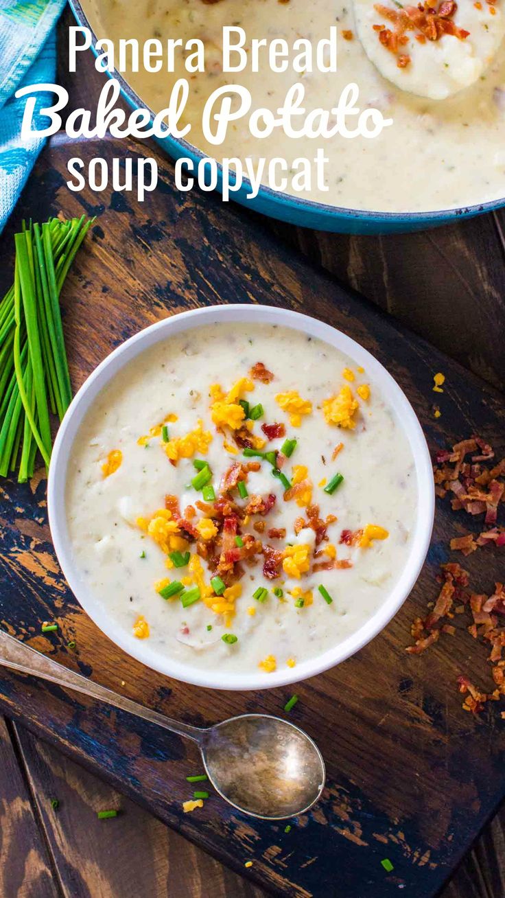 panera bread baked potato soup with bacon in a white bowl on a wooden cutting board