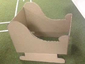 an open cardboard box sitting on top of a tennis court with white lines in the background