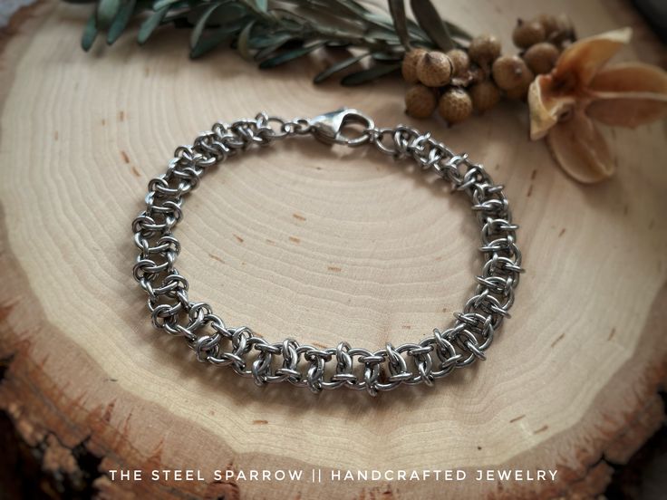 This beautiful Chainmaille bracelet was made by hand using all stainless steel rings in a Pterodactyl weave pattern. All rings and components are stainless steel. The bracelet measures 7" and has a lobster clasp. Stainless steel is very strong and durable and resistant to water, sweat, chemicals, saltwater, chlorine, etc. Clean with soap and water as needed.   * PLEASE NOTE: If you would like this item in a shorter/longer length, please write in the desired size at checkout under "Notes to Selle Handmade Stainless Steel Chain Bracelet As A Gift, Stainless Steel Braided Bracelet As Gift, Gunmetal Metal Chain Bracelet For Gift, Handmade Adjustable Chain Link Bracelets, Handmade Adjustable Stainless Steel Bracelets, Handmade Metal Charm Bracelet, Handmade Stainless Steel Gunmetal Jewelry, Handmade Link Bracelets In Stainless Steel, Handmade Gunmetal Stainless Steel Jewelry