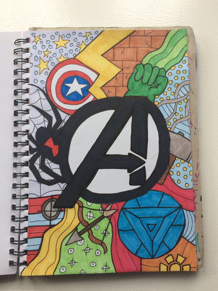 a spiral notebook with the avengers logo on it