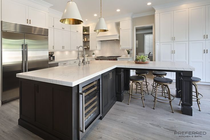 a large kitchen with an island in the middle