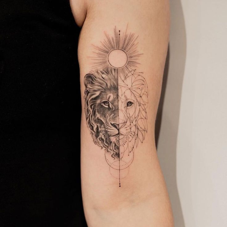 a woman's arm with a lion and sun tattoo on the left side of her body