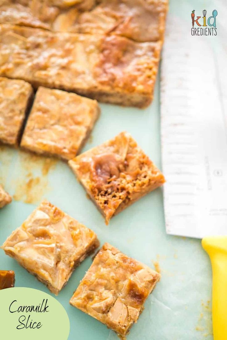 caramel slice desserts on a table with a measuring tape and knife in the background