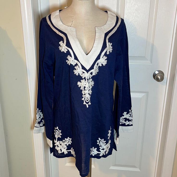 Navy And White With Embroidered Neck And Hem Navy Long Sleeve Summer Blouse, Navy Long Sleeve Blouse For Summer, Blue V-neck Embroidered Top For Beach, Navy Long Sleeve Beach Tops, Navy Long Sleeve Tops For Beach, Navy Long Sleeve Tops For The Beach, Embroidered Long Sleeve Blue Tunic, Long Sleeve Embroidered Blue Tunic, Blue Long Sleeve Embroidered Top For Beach