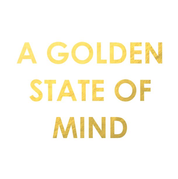 a golden state of mind written in gold on a white background