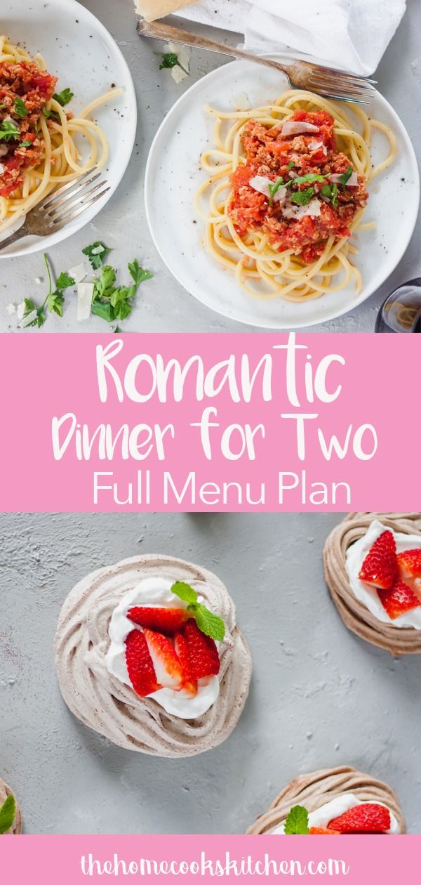 romantic dinner for two with pasta and strawberries on the side, served in white plates