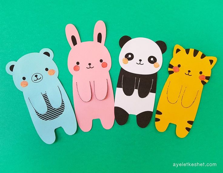 four paper animals are lined up together on a green surface with the words hello kitty, panda, and tiger