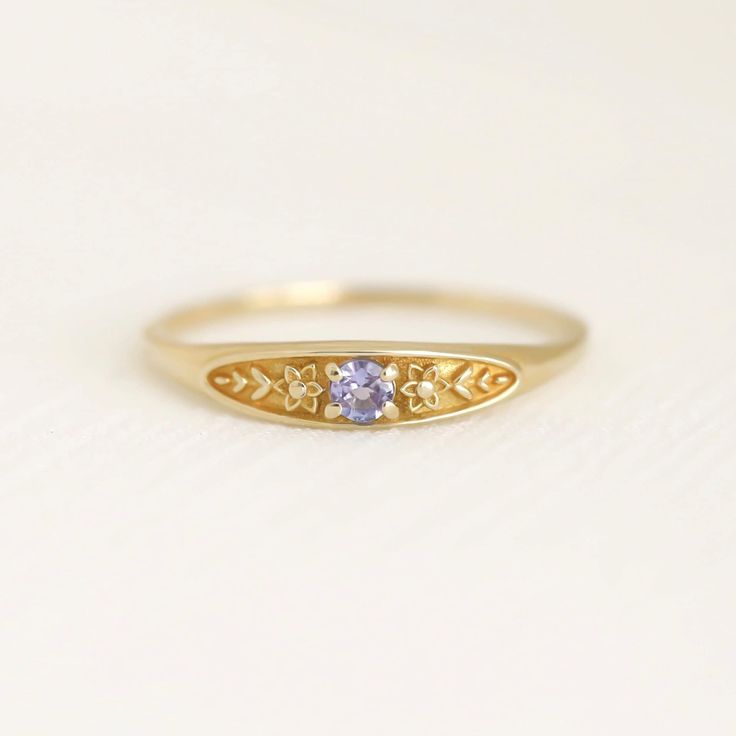 December birth ring This ring will be a very meaningful piece for those born in December. December's birthstone and birth flower are Tanzanite and Narcissus. Mystical tanzanite and delicately carved narcissus will shine and bloom forever. This dainty and slim signet ring is comfortable to wear all the time. This piece will be perfect gift for both to others and yourself. * Detail * Material : 14K solid gold, 18K solid gold, 925 sterling silver Color : Yellow gold, White gold or Rose gold(925 ste Birth Ring, Future Engagement Rings, Ring Birthstone, Tanzanite Ring, Meaningful Jewelry, Jewelry Studio, Birth Flower, Ring Gemstone, Birth Flowers