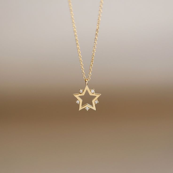 "JSVConcepts Fine Jewelry 14K Gold Star Pendant Necklace with Natural Diamonds / Constellation Star Charm Necklace / Star Pendant Necklace / Diamond Star Pendant ≫ Product Details ◈ Handmade / Handcrafted Fine Jewelry ◈ Pendant Size: approximately 11.70mm x 9.70mm ◈ Diamond: 100% Natural 'Conflict-Free' Diamond ◈ Diamond Carat Weight: .01 ct x 5 pieces = .05 ctw ◈ Diamond Color & Quality: G Color / VS-SI Clarity ◈ Cut: Brilliant Cut ◈ Metal: Solid 14k Gold (18k gold option available upon req Diamond Star Charm Pendant Necklace, Celestial Star Of David Necklace With Star Charm, Diamond Star Charm Necklace In Celestial Style, Gold Star Necklace With Diamond Accents, Gold Star Necklaces With Diamond Accents, Diamond Star Charm Necklace, Gold Star-shaped Necklace With Diamond Accents, Celestial Diamond Necklace With Star Charm, Celestial Diamond Star Charm Necklace