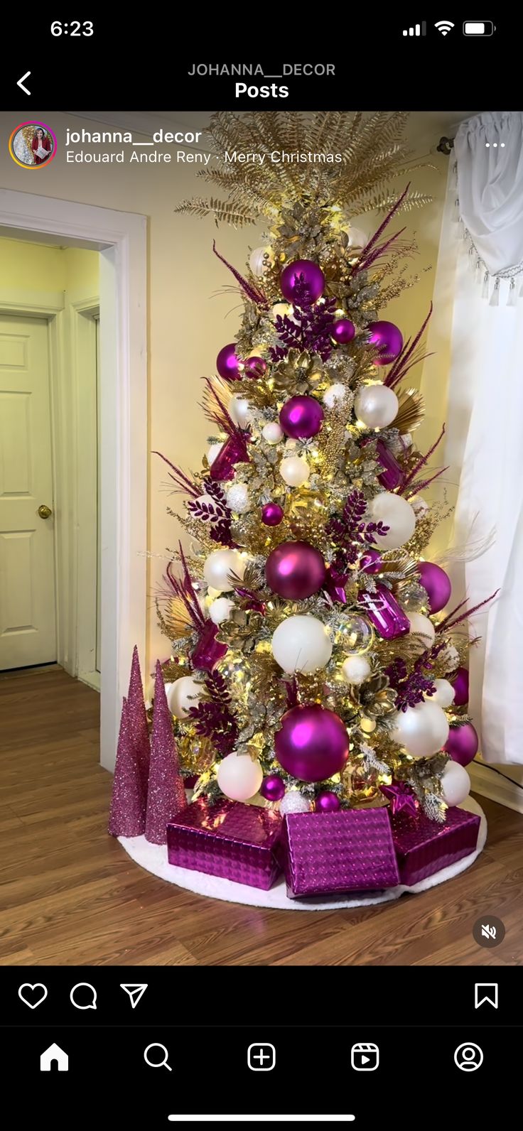 a christmas tree decorated with purple and white ornaments