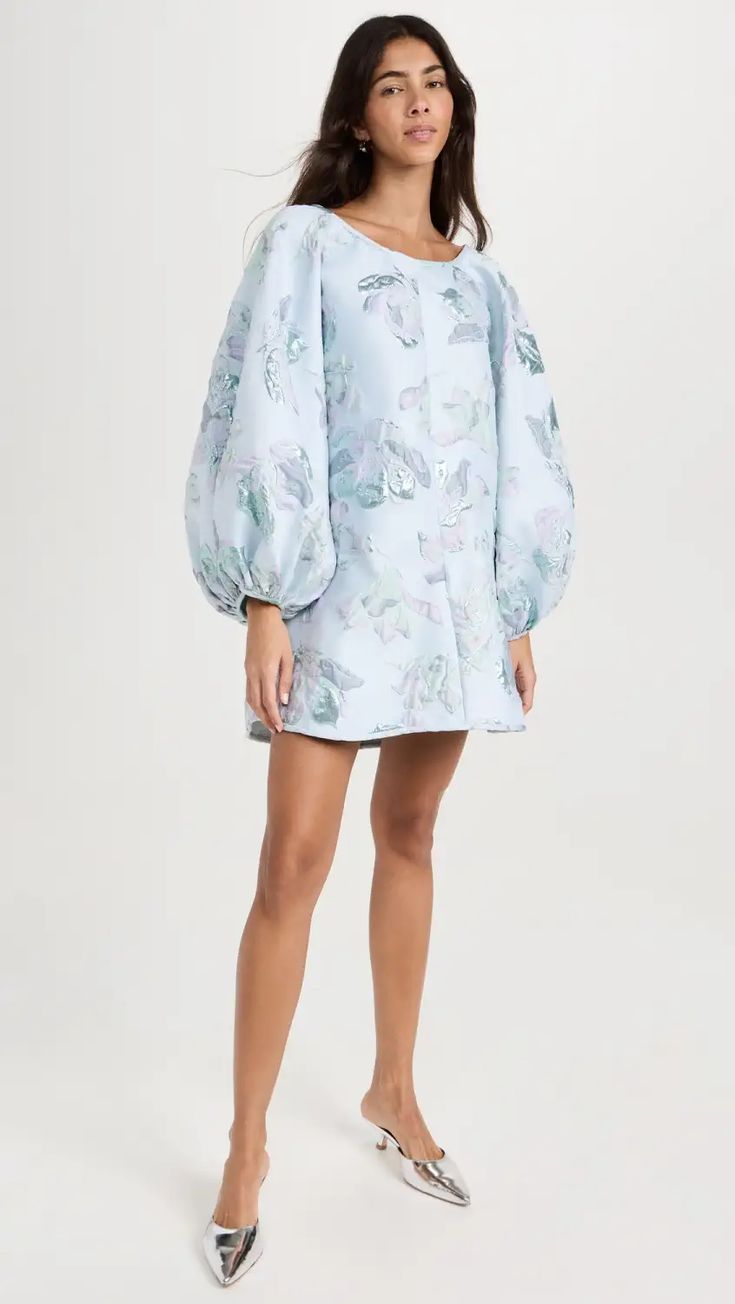 Sky Blue Magnolia Floral Good Luck Dress features Oversized 3D Floral Gardenia Pattern sprinkled with Metallic Blue and Purple by Arianne Elmy #FloralDress #OccasionDress #CocktailDress #BlueDress #ArianneElmy #BirthdayPartyDress #VacationDress #FlowyDress #WomensFashion #FallFashion #OOTD Spring Voluminous A-line Dress, Voluminous A-line Spring Dresses, Spring A-line Voluminous Dress, Voluminous Long Sleeve Summer Dress, Spring Voluminous Mini-length Dress, Spring Voluminous Mini Dress, Spring Mini Length Voluminous Dress, Elegant Oversized Blue Dress, Chic Oversized Blue Dresses