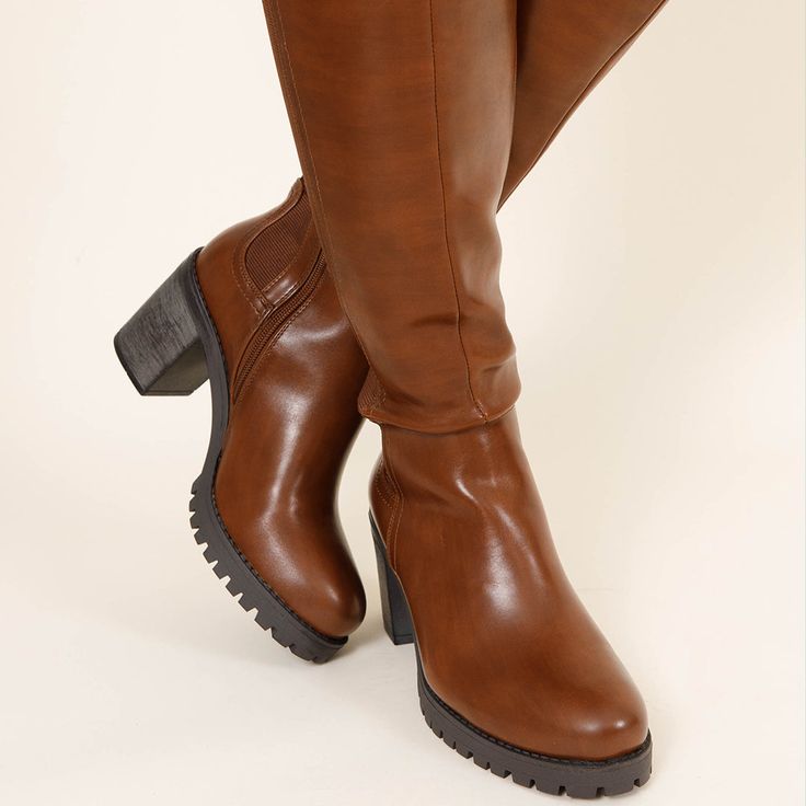 Our Reigning Champ Wide Calf Boots are the perfect combination of style and practicality. Crafted from a neutral brown, these boots feature a black heel, making them easy to pair with a variety of outfits. Whether it's sassy dresses or a cute blouse and skinnies, you'll look great and feel comfy all day long. Sassy Dress, Reigning Champ, Black Heel, Wide Calf Boots, Cute Blouses, Of Outfits, Wide Calf, Boots Brown, Calf Boots