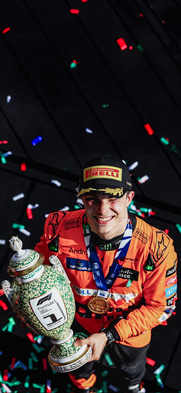 a man holding a fire hydrant in front of confetti