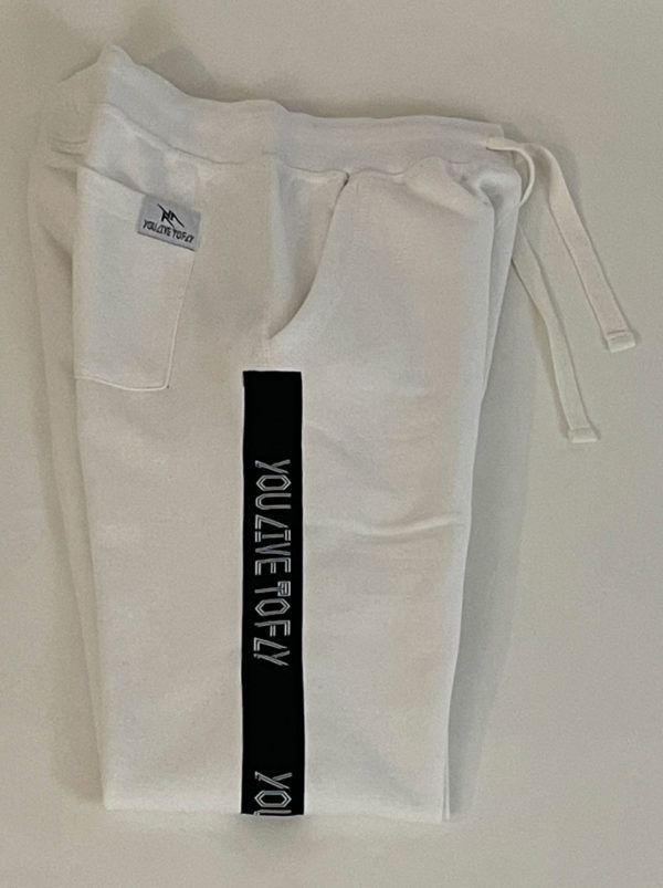 White YLF Joggers. Jogger pants feature YLF logo branding tape down the sides. Made from ultra-soft comfort cotton fleece with side slash pockets, back right pocket. Also feature a gusseted crutch for ultimate comfort and style and rib-knit ankle cuffs. Classic elasticized waistband and drawstring.

 

 

 	65% Cotton/35% Polyester Fleece
 	Machine wash cold White Letter Print Sweatpants For Streetwear, White Sporty Joggers With Letter Print, Sporty White Joggers With Letter Print, White Casual Joggers With Side Pockets, White Letter Print Joggers For Sports, White Letter Print Joggers For Leisure, White Sportswear Joggers With Side Pockets, White Joggers With Side Pockets, White Sports Sweatpants With Side Pockets