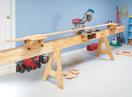 a workbench made out of wood with tools on the table and in front of it