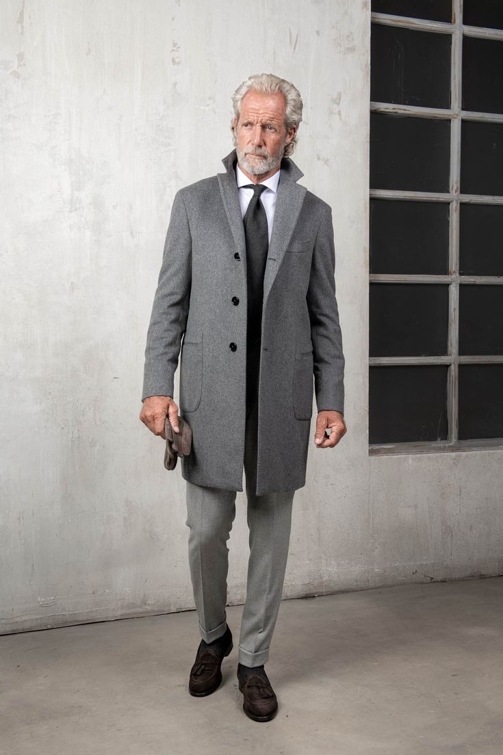 Our classic grey overcoat is crafted from luxurious and soft Loro Piana wool and is an essential formal outerwear piece that will show great versatility when worn over any suit. Composition: 100 % Loro Piana wool, "Capolavoro" collection - 570 gsmColor: GreyHalf canvas constructionNatural shoulders (no padding)"Barchet Formal Outerwear, Pini Parma, Grey Overcoat, Polo Coat, Beige Suits, Classic Grey, Grey Coat, Blue Coats, Blue Polo