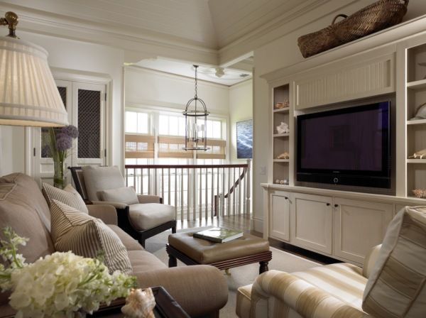 a living room filled with furniture and a flat screen tv