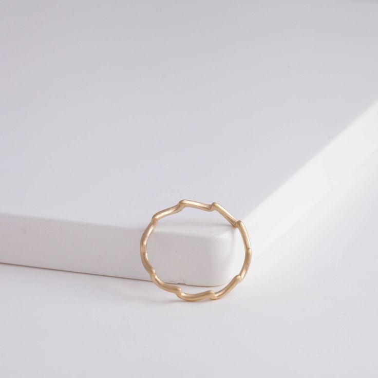 Description 10k yellow gold ring inspired by wavelets. The smooth waves that’s near the shore, the heave of sea on a rainy day, and the splashes created when an animal jumps out of the water are all inspiration of this wave collection. This elegant matte finished ring’s simple and clean look fits every occasion alone, or in your favorite ring stack. Details Gold band - Approximately 2mm from point to bottom (0.75mm band)10k Yellow Gold Made in Japan *This can be ordered to size. Please let us kn Minimalist 14k Gold Wavy Ring, Minimalist Yellow Gold Wavy Ring, Minimalist Wavy Yellow Gold Ring, Favorite Rings, Stacking Rings, Yellow Gold Rings, Gold Bands, Rainy Day, Gold Rings