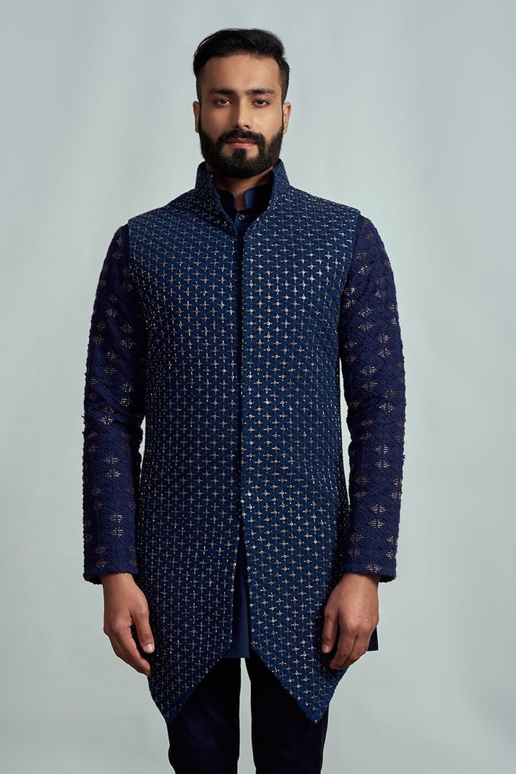 Navy blue bundi with embroidered motifs. Comes with kurta and pant.
Component: 3
Embroidery
Neckine: Kurta: Band collar; Bundi: Band collar
Sleeve Length: Kurta: Full; Bundi: Sleeveless
Fabric: Suiting
Color: Blue - Aza Fashions Kurta Set Men, Kurta Set For Men, Embroidered Motifs, Nehru Jacket, Nehru Jackets, Band Collar, Kurta Set, Aza Fashion, Color Blue