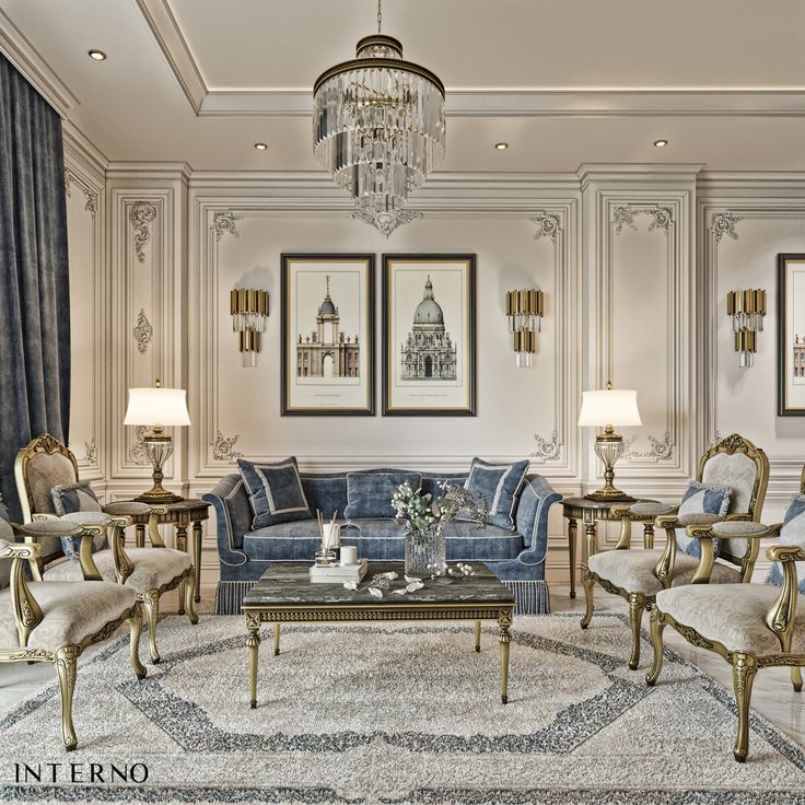 an elegant living room with blue couches and gold chairs, chandelier and pictures on the wall