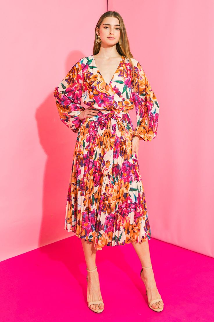 Make a statement in the YOU MAKE ME FEEL WOVEN MIDI DRESS. With a surplice neckline, peasant sleeves and pleated skirt, this printed midi dress will be sure to turn heads. The elasticized waist with a self sash belt provides the perfect fit for a flattering silhouette. Details Self : 100% Polyester Lining : 100% Polyester Size & Fit - Model is 5`8" And Wearing Size Small - Measurements Taken From Size Small - Approx. Length: 48" Spring V-neck Midi Dress With Pleated Waist, Multicolor Dress With Gathered Sleeves For Garden Party, Multicolor Dresses With Gathered Sleeves For Garden Party, Pleated V-neck Maxi Dress For Brunch, V-neck Pleated Maxi Dress For Brunch, Spring Multicolor Midi Dress With Surplice Neckline, Multicolor Surplice Neckline Midi Dress For Spring, Multicolor Flowy Dress With Surplice Neckline, Garden Party V-neck Midi Dress With Gathered Sleeves