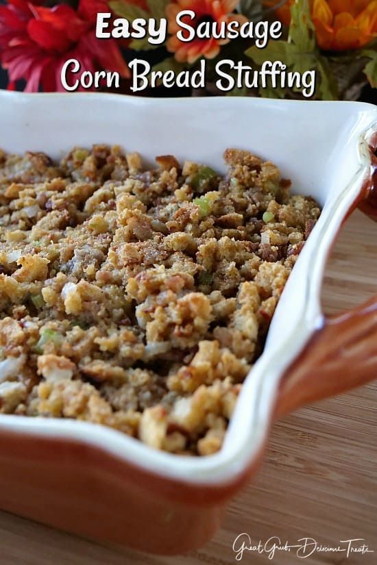 an easy sausage cornbread stuffing recipe in a casserole dish on a wooden table