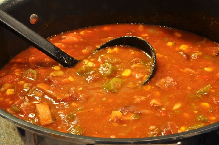 a pot full of soup with a ladle in it