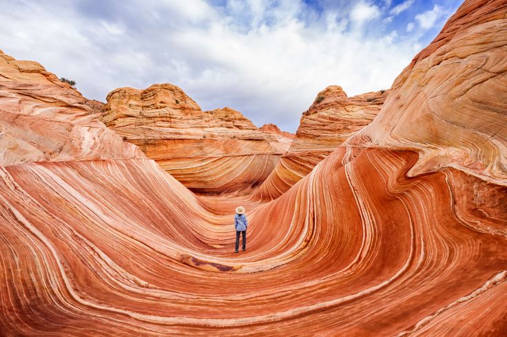 a person standing in the middle of an area that looks like it is made out of rock