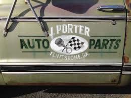 an old car with the words j potter auto parts painted on it