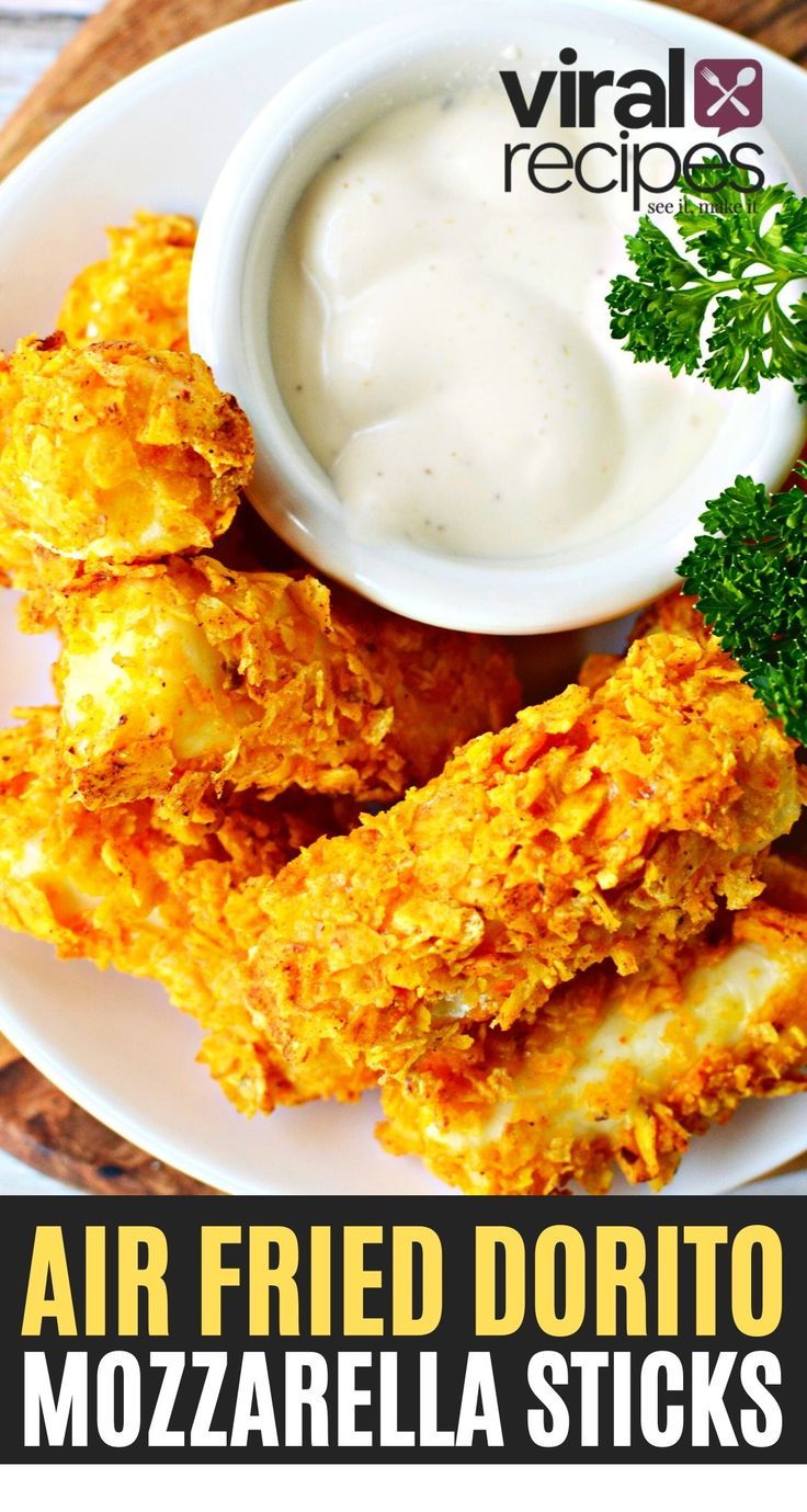 air fried doritoo mozzarella sticks on a plate with ranch dip and parsley