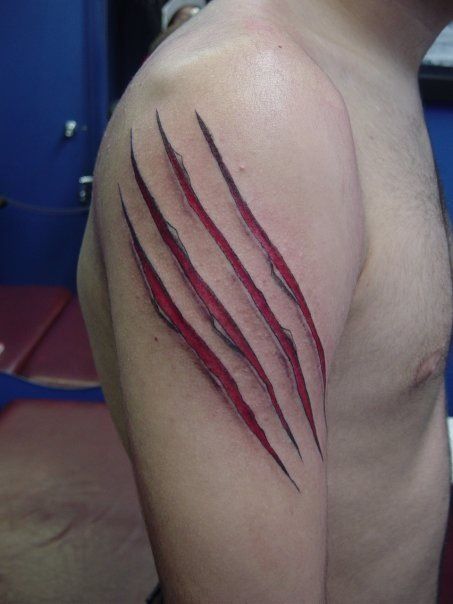 a man's arm with red lines on it