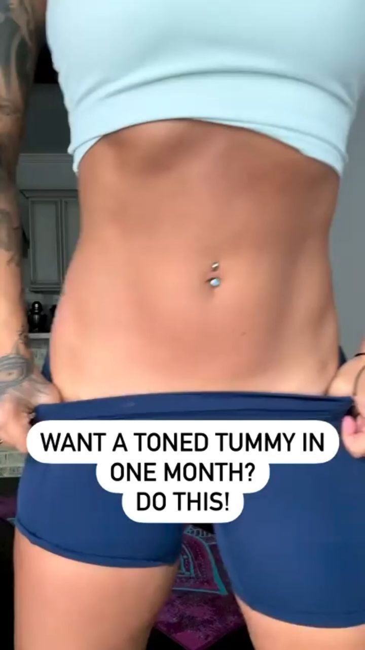 a woman is showing off her stomach with the words want a toned tummy in one month? do this