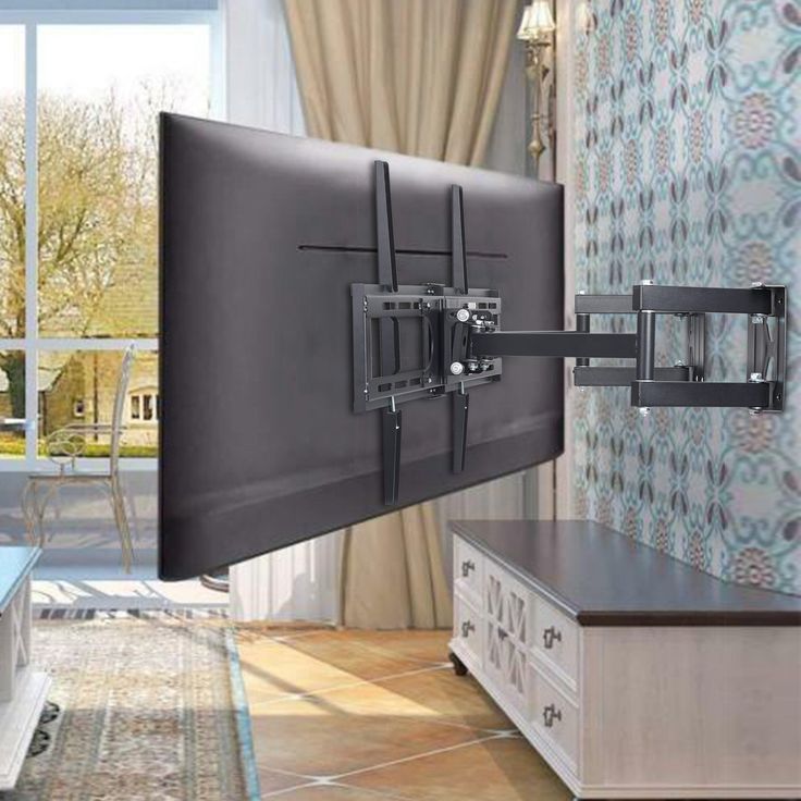 a flat screen tv mounted to the side of a wall