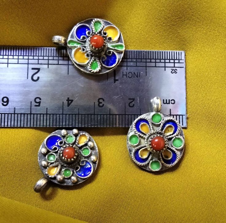 Three ancient Kabyle ethnic pendants to be mounted on necklaces, in solid silver with coral beads. I still have others of the same kind but different on my shop, you can visit it. **Height: 2.5 cm. **Width: 1.9 cm. **Material: sterling silver, real coral. **Total weight: 17.5 grams. **Origin: Region of the Great Kabyle 1980s - Algeria. **Free shipping worldwide by DHL. I am always open to offers for one of my items, so please contact me if you would like to make an offer. Please contact me if yo Traditional Pendant Beads For Jewelry Making, Handmade Silver Amulet Beads, Silver Amulet Beads As Gift, Silver Amulet Beads For Gifts, Traditional Sterling Silver Pendant Beaded Necklace, Spiritual Silver Pendant Beads, Silver Amulet Pendant Beaded Necklace, Silver Beaded Amulet Pendant Necklace, Handmade Silver Pendant Beads