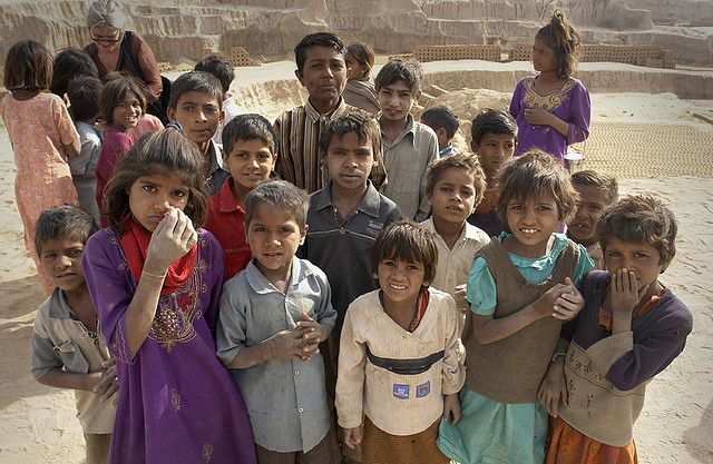 a group of young children standing next to each other