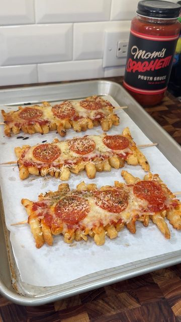 pizza skewers on a baking sheet ready to go into the oven with pepperoni