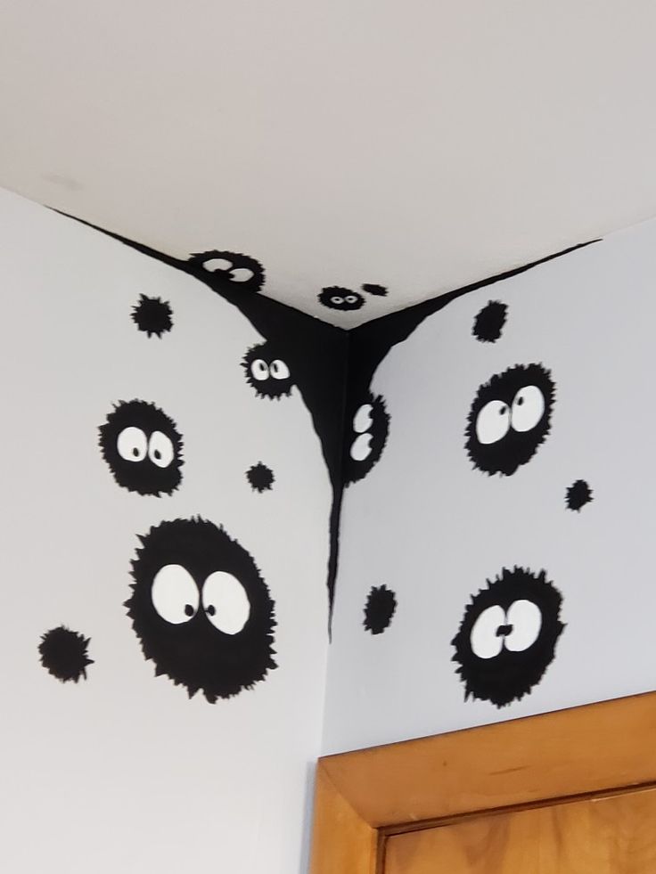 the black and white wall is decorated with monsters