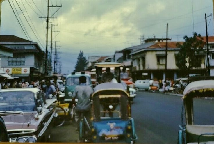 a busy street with cars and people on it